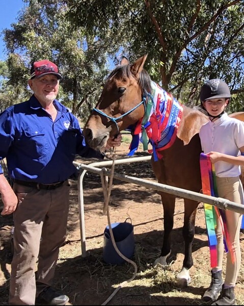 maya with horse and ribbons