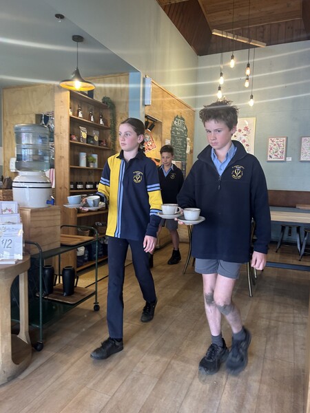Kate and Tom serving Coffee