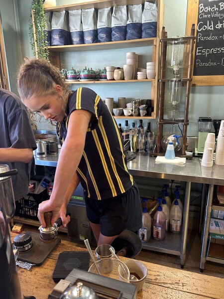 Madison W making coffee
